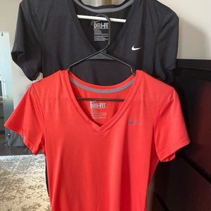 Black and red Nike athletic shirts
